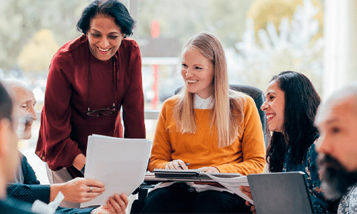 Academics and staff in a group meeting