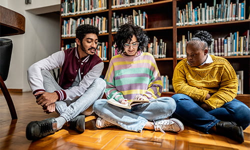 Here for Good students in library